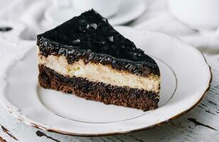 Cottage cheese cake with prunes and chocolate photo