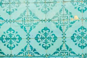 colorful tile pattern on the wall of a building photo