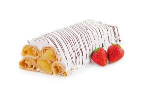 Strawberry crepes with whipped cream isolated photo