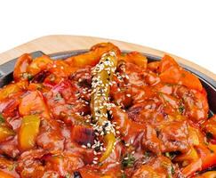 pan with vegetable stew on wooden board photo