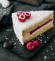 Winter cake with white cream decorated raspberries photo