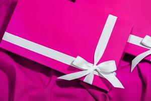 Christmas gifts presents on pink background photo