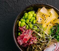 Hawaiian tuna poke salad in the bowl top view photo