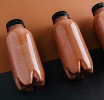 chocolate smoothies in plastic bottles photo