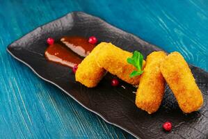 Breaded chicken strips with tomato ketchup photo