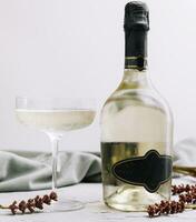prosecco bottle with wine glass photo