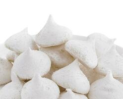 Bowl of meringue cookies isolated on white photo