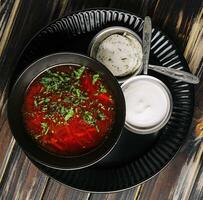 Ukrainian cuisine - borscht with sour cream photo