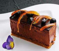 Chocolate cheesecake with fresh berries on plate photo