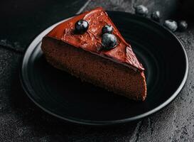 Chocolate brownie cakes with blueberry on plate photo