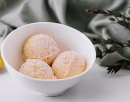 Homemade sweet apricot ice cream close up photo