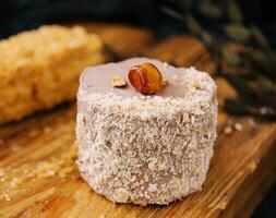 Kiev cake with Hazelnut and chocolate on board photo