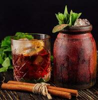 two alcoholic cocktails with old-fashioned glasses photo