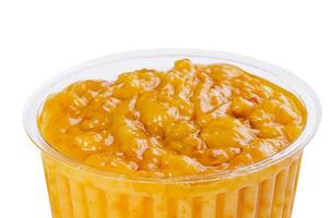 Bowl of tasty honey mustard sauce on white background photo