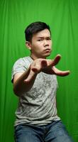 A Man Engaging in Playful Hand Gestures, Adding a Touch of Dynamism photo