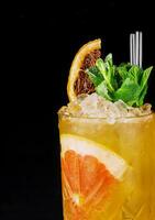 Fresh tropic cocktail with orange and grapefruit photo