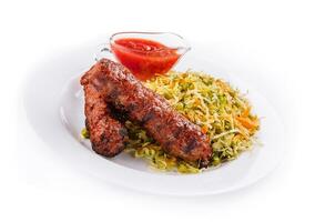 Moldavian Traditional Mititei Mici Meat Sticks with Cabbage and a Sauce photo