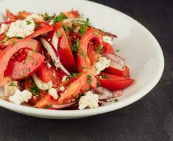 Salad with Goat Cheese, dill, Tomato and Red Onion Rings photo
