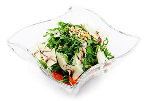 Arugula salad with sunflower kernels and sprinkled with grated parmesan photo