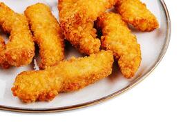 Chicken nuggets on plate close up photo