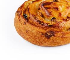 Sweet baked snail with raisins and almond photo