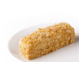 Slice of Napoleon Cake on a white plate photo