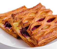 Delicious puff pastry with raspberry jam photo