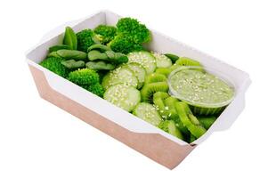 green set of vegetables and fruits in a cardboard box photo