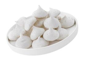 Bowl of meringue cookies isolated on white photo