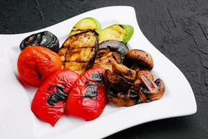 Grilled vegetables on white plate photo