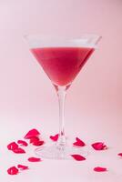 Strawberry alcohol cocktail in martini glass photo