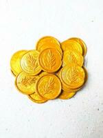 Close up shot of colorful wax coin for wedding invitation decoration or vintage look for a letter. Top view. photo