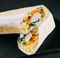 grilled shawarma of chicken, cucumbers and fries photo