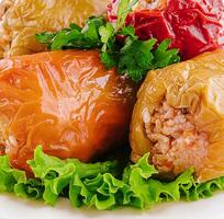 Yellow and red peppers stuffed with rice photo