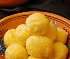 cheese balls with garlic inside in bowl photo