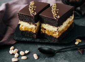 Fluffy snickers cake on stone board photo