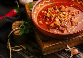 Mexican hot chili con carne in a bowl photo