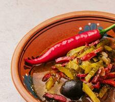 meat soup Solyanka in bowl close up photo