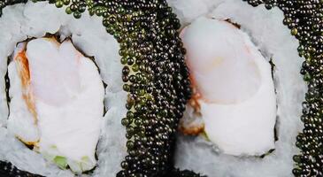 sushi rolls - Phila Black with black caviar, shrimp and cheese photo