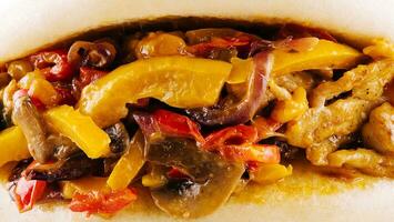 Pita stuffed with chicken, mushrooms, onions and peppers photo