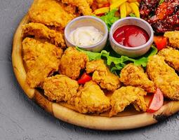 baked crispy chicken wings on board photo