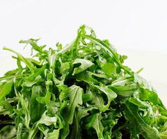 Italian beef tagliata salad with wild rocket, cherry tomatoes and parmesan cheese photo