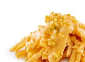 Pouring cheese sauce on french fries on white background photo