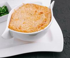 French onion soup with cheese in bowl photo