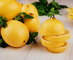 Fresh sliced lemon on the wooden table photo