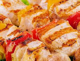 pork skewers with grilled bell peppers and mushrooms photo