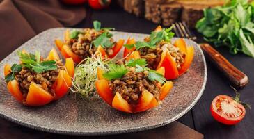 Tasty red stuffed tomatoes with rice and minced meat photo