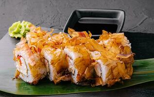 Sushi bonito roll on a dark background photo