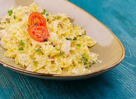 tasty farfalle pasta with parmesan cheese photo