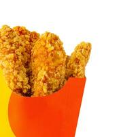 fried chicken nuggets in take out box isolated photo